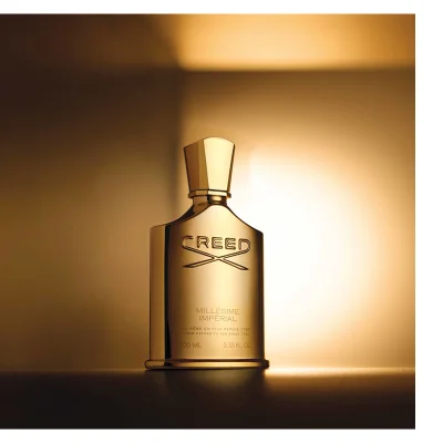 Gold Creed perfume bottle with text CREED MILLÉSIME IMPÉRIAL DE PÈRE EN FILS DEPUIS 1760 FROM FATHER TO SON SINCE 1760 100 ML 3.33 FL. OZ.