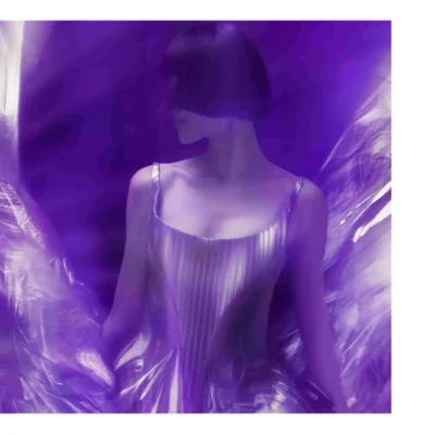 Purple-toned image of a person with short dark hair in a shiny pleated dress surrounded by reflective material